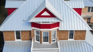 Red brick building with metal roofing.