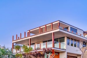 Multilevel property with flat roofing.