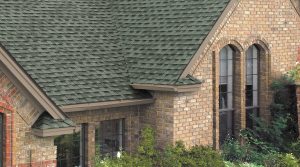 Brick home with dark tile roof.